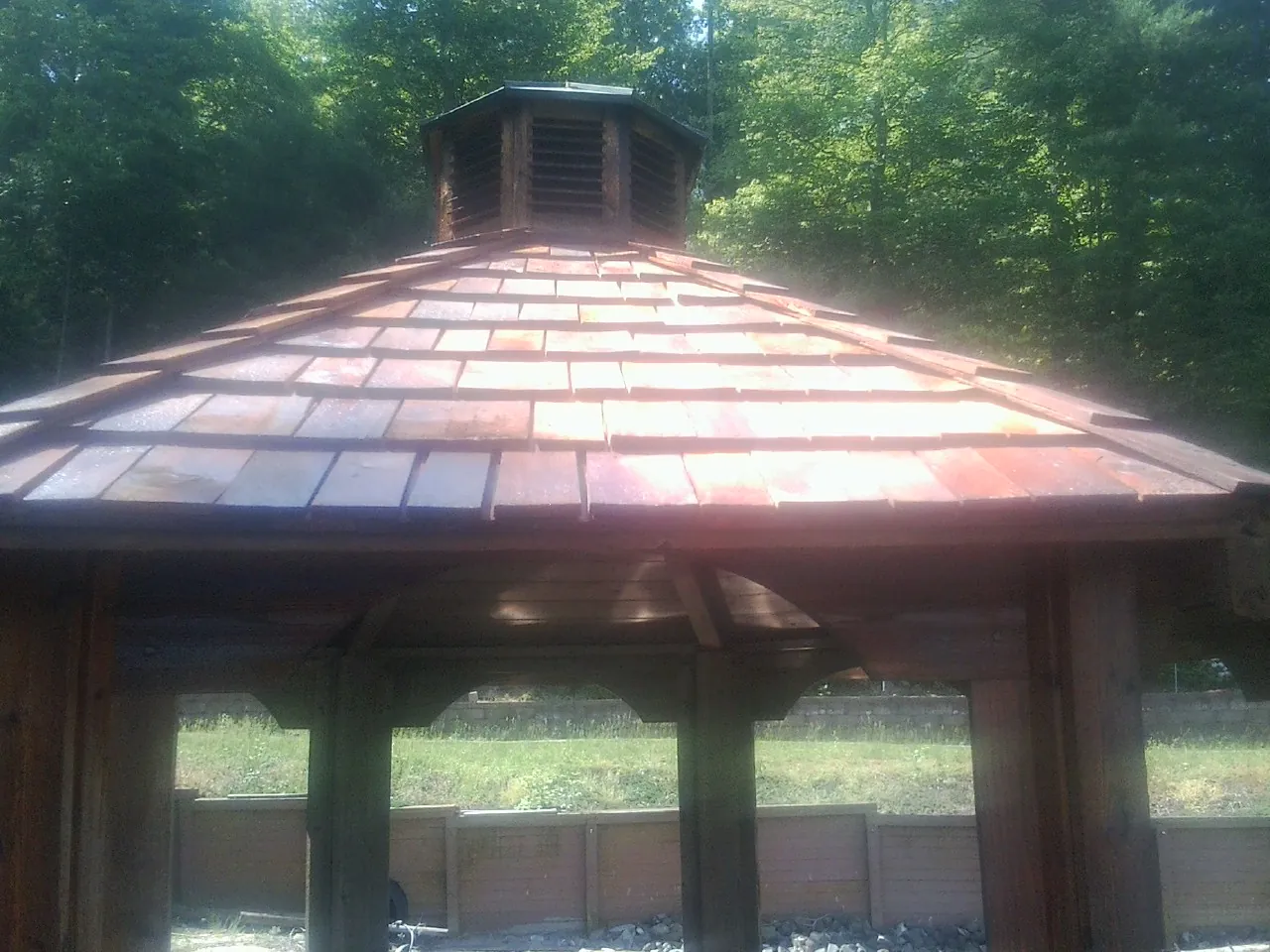 New cedar shake roof and cupola on a lakeside gazebo in Saegertown